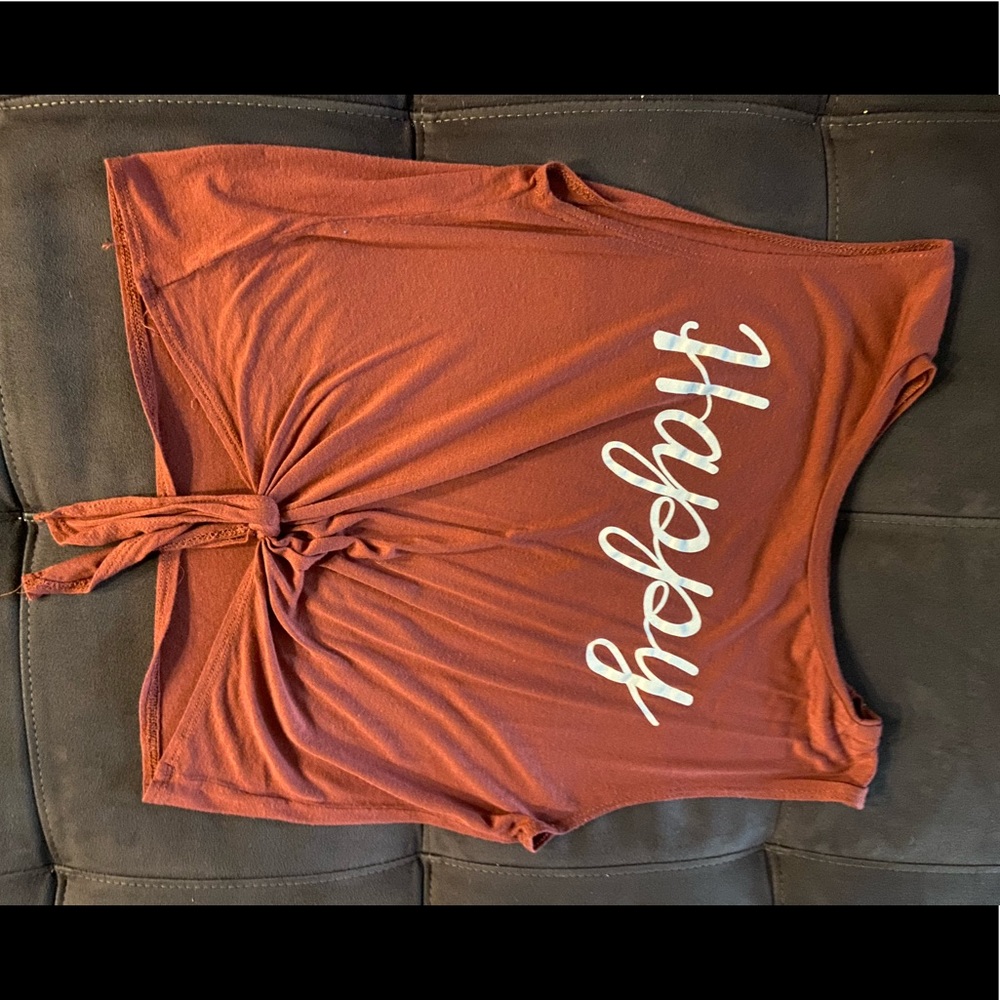 Orange/red tied in the front crop top with words